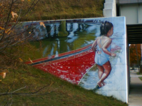 Girl playing at the Poseyville overpass.