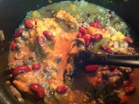 My venison chili, before adding spices and molasses. The lumpy stuff is refried beans. I like it very thick.