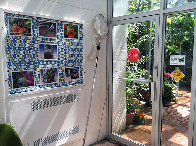 The vestibule, with warning signs and a long-handled net