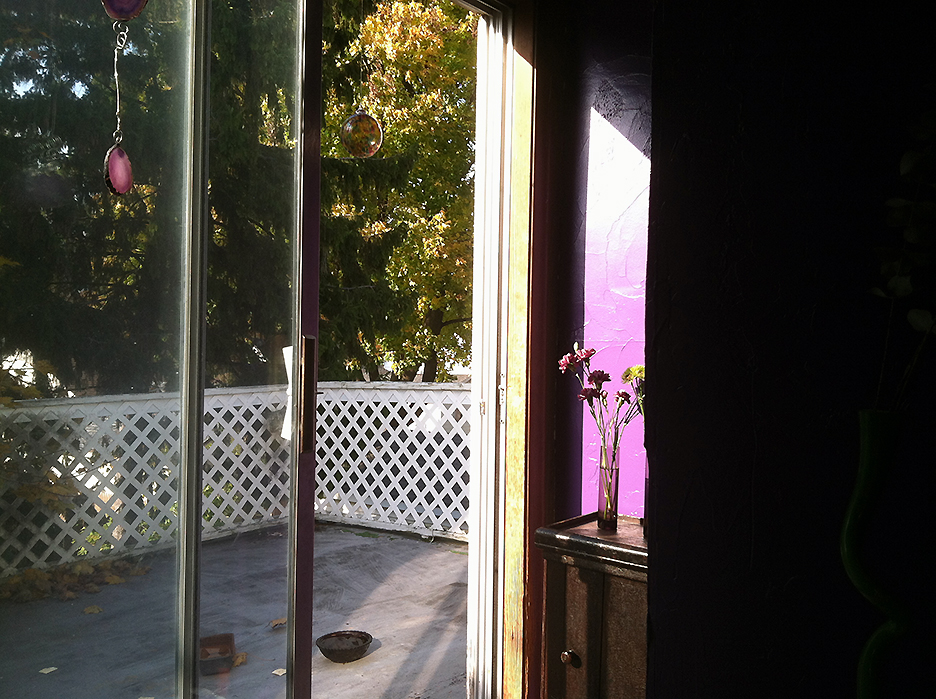 View out a sliding glass door onto a balcony