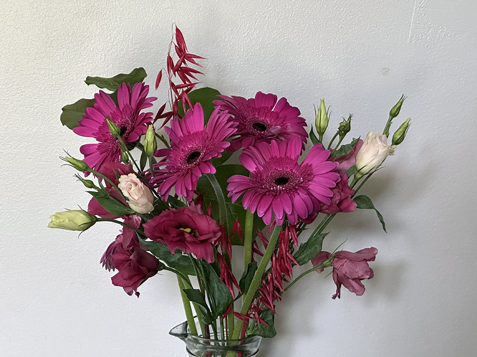 photo of a grocery bouquet of assorted pink flowers