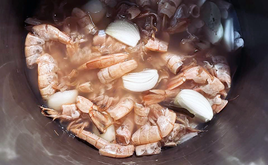 shrimp shells and onions in a pot